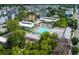 Aerial view of community featuring pool with lounge chairs, lush greenery and colorful buildings at 4631 Scout Aly, North Charleston, SC 29405
