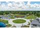 Overhead view featuring a baseball field and playground, set around a central green space with walkways at 4631 Scout Aly, North Charleston, SC 29405