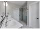 Bright bathroom featuring a double vanity, decorative tile floor, and a glass-enclosed shower at 4631 Scout Aly, North Charleston, SC 29405
