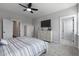 Bedroom with neutral tones, features plush carpeting, ceiling fan, and stylish dressers at 4631 Scout Aly, North Charleston, SC 29405