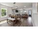 Dining area is open to the living room, showcasing a fireplace, sofa, and natural light at 4631 Scout Aly, North Charleston, SC 29405