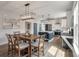 The dining area has a rectangular chandelier hanging above a wooden table with seating for six at 4631 Scout Aly, North Charleston, SC 29405