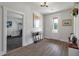Welcoming entryway with hardwood floors, a console table, and an adjacent home gym at 4631 Scout Aly, North Charleston, SC 29405