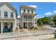 Charming two-story pink home with a white picket fence, offering a cozy and inviting curb appeal at 4631 Scout Aly, North Charleston, SC 29405