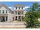 Charming two-story pink home with a white picket fence and double balconies, perfect for enjoying the outdoors at 4631 Scout Aly, North Charleston, SC 29405
