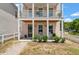 Inviting front porch with rocking chairs, perfect for relaxing and enjoying the neighborhood views at 4631 Scout Aly, North Charleston, SC 29405