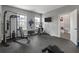 Well-equipped home gym featuring weightlifting machines, a TV, and rubber flooring for comfort at 4631 Scout Aly, North Charleston, SC 29405