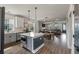 This modern kitchen has white cabinets, stainless appliances, and a beautiful island with counter seating at 4631 Scout Aly, North Charleston, SC 29405