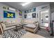 Cozy living room with a large sectional sofa, sports memorabilia, and an open doorway at 4631 Scout Aly, North Charleston, SC 29405
