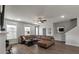 The open-concept living area features wood floors, a brown sectional sofa, and plenty of natural light at 4631 Scout Aly, North Charleston, SC 29405
