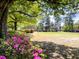 Scenic park view featuring lush flowers, towering trees, and a peaceful atmosphere for relaxation at 4631 Scout Aly, North Charleston, SC 29405