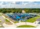 A vibrant community playground featuring blue shades, modern equipment, and accessible design for outdoor fun at 4631 Scout Aly, North Charleston, SC 29405