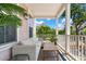 Inviting porch featuring comfortable wicker seating and a wooden table for outdoor relaxation at 4631 Scout Aly, North Charleston, SC 29405