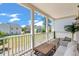 Covered porch providing an open-air space, complete with seating and views of the neighborhood at 4631 Scout Aly, North Charleston, SC 29405