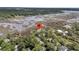 Aerial view of a large home with a dock on the marsh at 4702 Blockhouse Ln, Hollywood, SC 29449