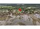 Expansive aerial view showcasing a waterfront property with private docks and lush surroundings at 4702 Blockhouse Ln, Hollywood, SC 29449