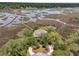 Picturesque waterfront property with private dock access and lush greenery at 4702 Blockhouse Ln, Hollywood, SC 29449