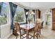 Bright breakfast nook with large windows offering a view of surrounding greenery and blue skies at 4702 Blockhouse Ln, Hollywood, SC 29449