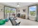 Home gym featuring a Total Gym, exercise equipment, and bright windows overlooking the landscape at 4702 Blockhouse Ln, Hollywood, SC 29449
