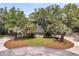 Stately home featuring a large front porch and manicured lawn and landscaping at 4702 Blockhouse Ln, Hollywood, SC 29449