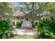 Beautiful exterior featuring a grand entrance with manicured landscaping, offering stunning views of this stately home at 4702 Blockhouse Ln, Hollywood, SC 29449