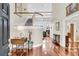 Elegant foyer featuring hardwood floors, high ceilings, and a view of the staircase at 4702 Blockhouse Ln, Hollywood, SC 29449
