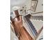 Elegant foyer with hardwood floors, chandelier, staircase, and striking wood front door at 4702 Blockhouse Ln, Hollywood, SC 29449