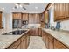 Spacious kitchen features custom wood cabinetry, granite countertops and stainless steel appliances at 4702 Blockhouse Ln, Hollywood, SC 29449