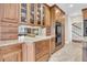 Custom wood cabinetry flanks built-in double ovens and a granite countertop in this well-appointed kitchen at 4702 Blockhouse Ln, Hollywood, SC 29449