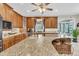 Bright kitchen with granite counters, wood cabinets, an island with seating, and stainless steel appliances at 4702 Blockhouse Ln, Hollywood, SC 29449