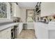 Well-lit laundry room features ample counter space, plenty of cabinets, and modern washer and dryer at 4702 Blockhouse Ln, Hollywood, SC 29449