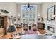 Bright living room with large windows, fireplace, and comfortable seating area at 4702 Blockhouse Ln, Hollywood, SC 29449