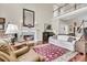 Spacious living room with a fireplace, high ceilings, and hardwood floors at 4702 Blockhouse Ln, Hollywood, SC 29449