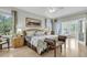 Large main bedroom with natural light, comfortable furnishings, and access to an adjacent living area at 4702 Blockhouse Ln, Hollywood, SC 29449