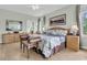 Spacious main bedroom with hardwood floors, and comfortable furnishings at 4702 Blockhouse Ln, Hollywood, SC 29449