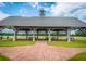 Community pavilion with picnic benches overlooking a horse race track provides ample room for gatherings at 4702 Blockhouse Ln, Hollywood, SC 29449