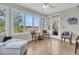 Bright sunroom featuring a door to the outside and comfortable seating at 4702 Blockhouse Ln, Hollywood, SC 29449