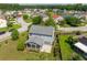 An aerial view of the property, showcasing the backyard, screened porch, and surrounding neighborhood at 489 Dolphin Dr, Summerville, SC 29485