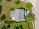 An aerial view from above the home showing the roof, backyard and screened in patio at 489 Dolphin Dr, Summerville, SC 29485