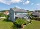 An aerial view of the backyard featuring a screened-in porch and manicured landscaping at 489 Dolphin Dr, Summerville, SC 29485