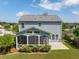 An aerial view of the backyard featuring a screened porch and concrete patio at 489 Dolphin Dr, Summerville, SC 29485