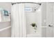 Bright bathroom featuring a shower-tub combination and modern fixtures at 489 Dolphin Dr, Summerville, SC 29485