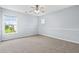 Bedroom featuring two large windows for natural light and neutral carpet at 489 Dolphin Dr, Summerville, SC 29485