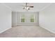 Comfortable carpeted bedroom with ceiling fan and good natural light from two windows at 489 Dolphin Dr, Summerville, SC 29485