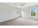 Bedroom showcasing carpet floors, two windows allowing natural light, and neutral walls at 489 Dolphin Dr, Summerville, SC 29485