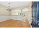 Bright entryway featuring hardwood floors, an elegant chandelier, and arched doorways at 489 Dolphin Dr, Summerville, SC 29485