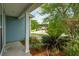 Exterior view from the covered porch with view of trees and the neighborhood at 489 Dolphin Dr, Summerville, SC 29485