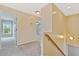 Hallway and staircase with neutral carpet and paint, leading to bedroom at 489 Dolphin Dr, Summerville, SC 29485