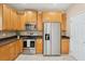 Kitchen featuring stainless steel appliances, tile floors, and white door at 489 Dolphin Dr, Summerville, SC 29485