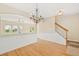 Bright room with hardwood floors, staircase, and view of open floor plan at 489 Dolphin Dr, Summerville, SC 29485